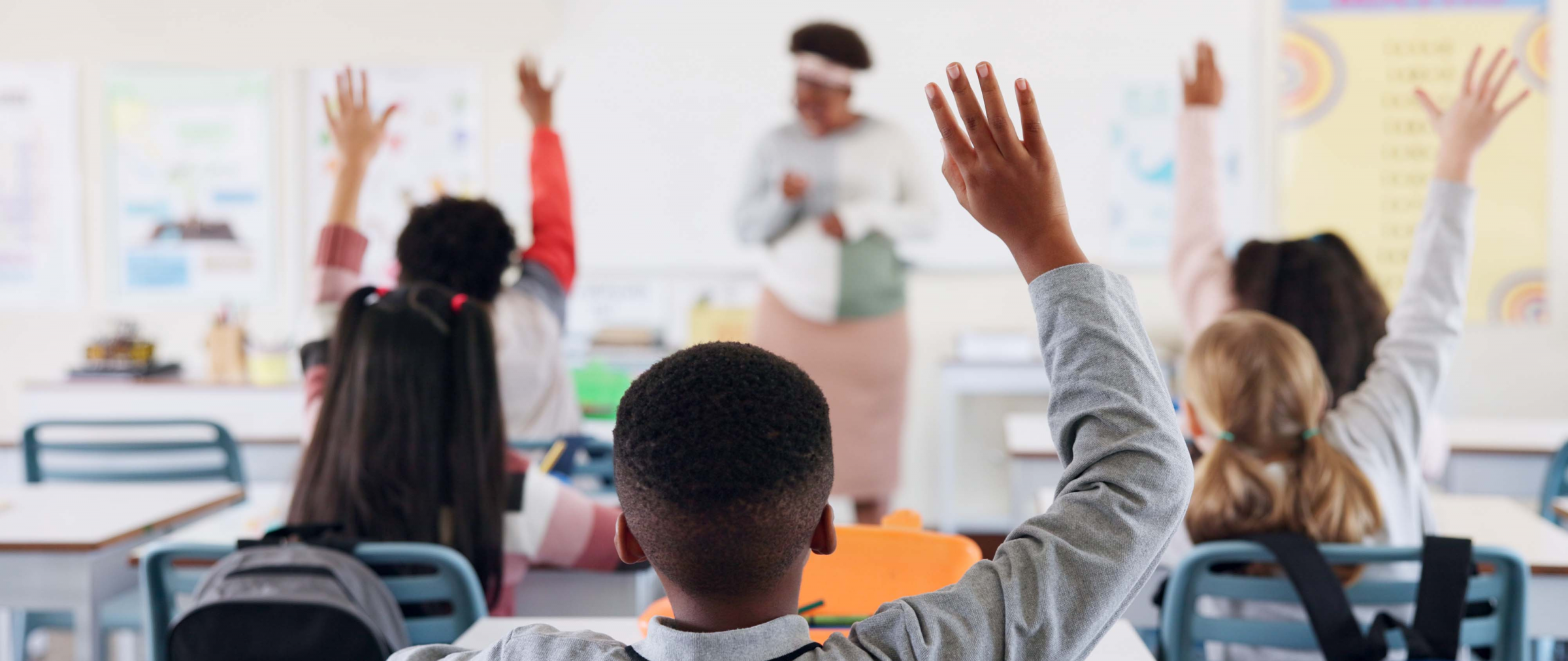 Kids with hands up for questions